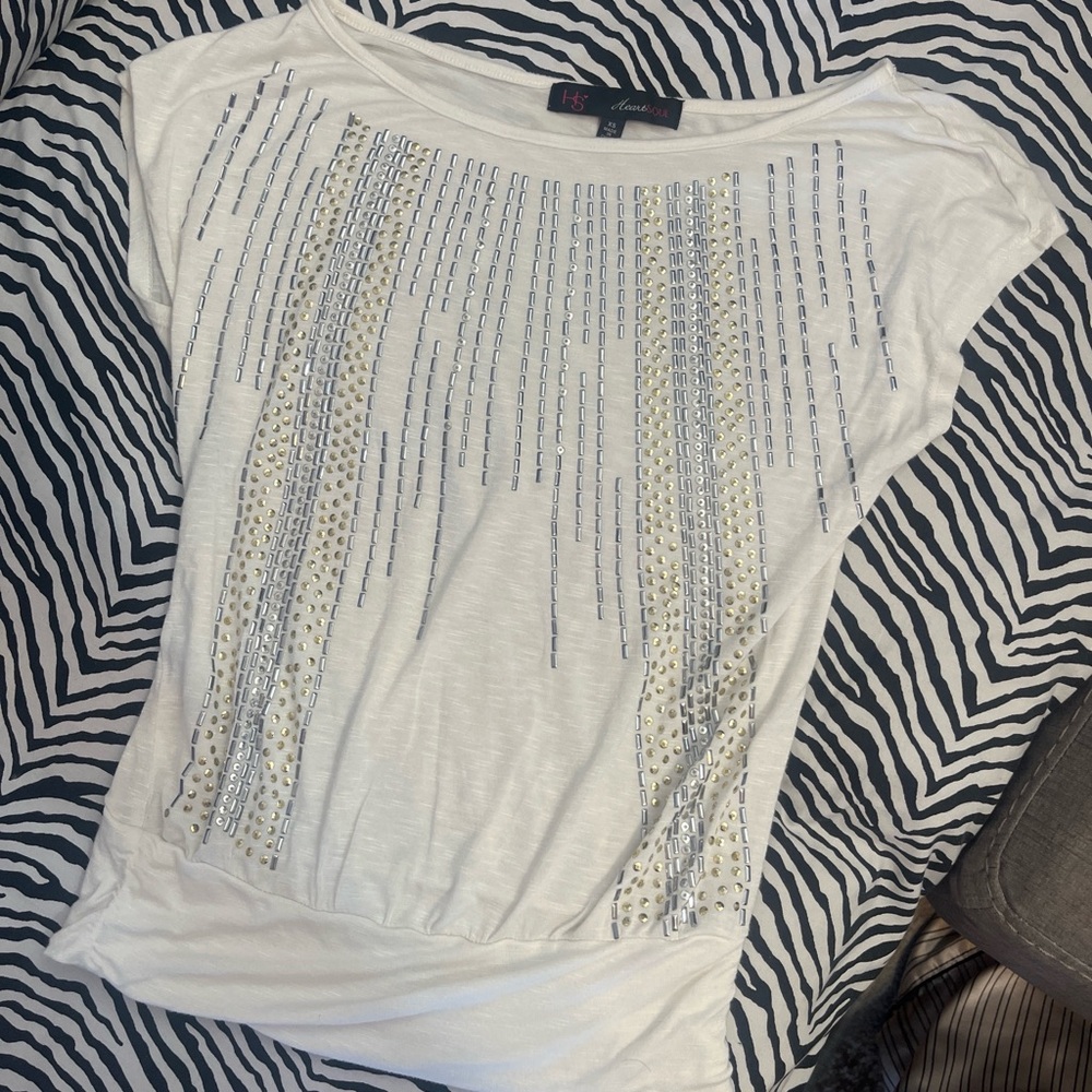 women’s top with gold and silver details